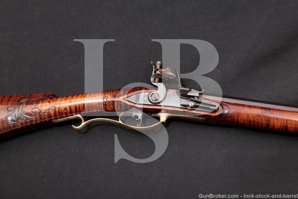 Group of contemporary flintlock rifle accessories sold at auction