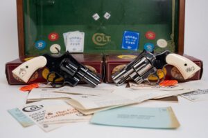 MATCHED PAIR OF COLT PYTHON SNAKE EYES .357 MAG REVOLVERS, DISPLAY CASE & BOX