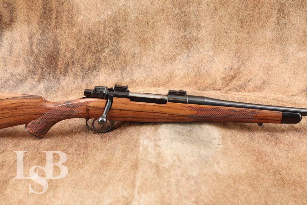 LSB# LSb250527JB003

Make: Zbrojovka Brno

Model: G.33/40

Serial Number: NSNV 

Year of Manufacture: 1934

Caliber: 6.5-06

Action Type: Bolt action, fed by internal magazine with hinged floorplate 

Barrel Length: 24”

Sights / Optics: No provision for iron sights. Receiver has two scope bases.  

Stock Configuration & Condition: The stock is a single piece checkered walnut stock with capped pistol grip, straight comb with cheek piece, decelerator rubber buttpad, capped forend, and two sling platelets front and rear. LOP measures 13 1/8" from the front of the trigger to the rear of the buttpad. The stock rates in Excellent Condition with sharp checkering and minimal handling wear. 

Type of Finish: Blue

Finish Originality: Refinished

Bore Condition: The bore is bright, and has no erosion, and the rifling is sharp. It is this writer's opinion that the condition of the bore is 10/10. 

Overall Condition: This rifle retains about 99% of its metal current finish. The balance of the finish shows little to know operational wear post being refinished. The markings are clear, the screwheads are sharp. There is engraving on the bottom metal that is crisp. Overall this rifle rates in Excellent Condition. 

Mechanics: The action functions correctly. We did not fire this rifle. As with all used firearms, a thorough cleaning may be necessary to meet your maintenance requirements.

Box, Paperwork & Accessories: None. 

Our Assessment: The 6.5-06 is a high-velocity wildcat cartridge based on the .30-06 Springfield case necked down to accept 6.5mm projectiles. It offers excellent long-range performance with flatter trajectories, higher ballistic coefficients, and lighter recoil than the parent case, making it a favorite among precision shooters and hunters pursuing medium game. With ample case capacity and efficient bullet profiles, the 6.5-06 delivers impressive energy retention and accuracy at extended distances, rivaling the performance of factory 6.5mm offerings like the 6.5 Creedmoor and .260 Remington, while offering more flexibility in handloading. This is a beautiful sporterized rifle that will make a great hunting rifle. Please see our photos, and good luck on your bidding! - J.D. 